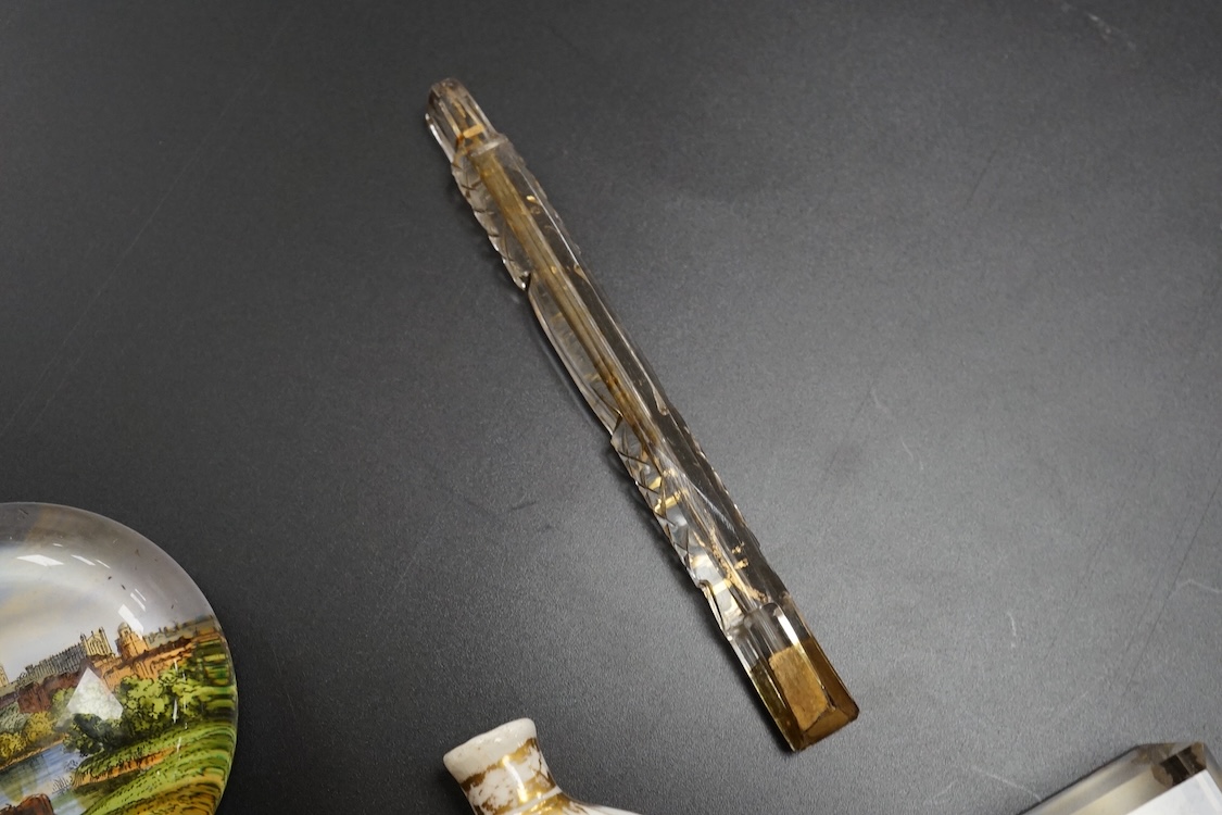 Six pictorial glass gem paperweights and three 19th century scent bottles, largest 11cm in length